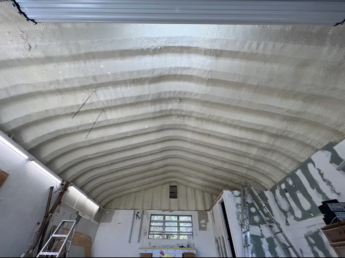 Spray polyurethane foam applied to the underside of a metal roof deck in Deptford